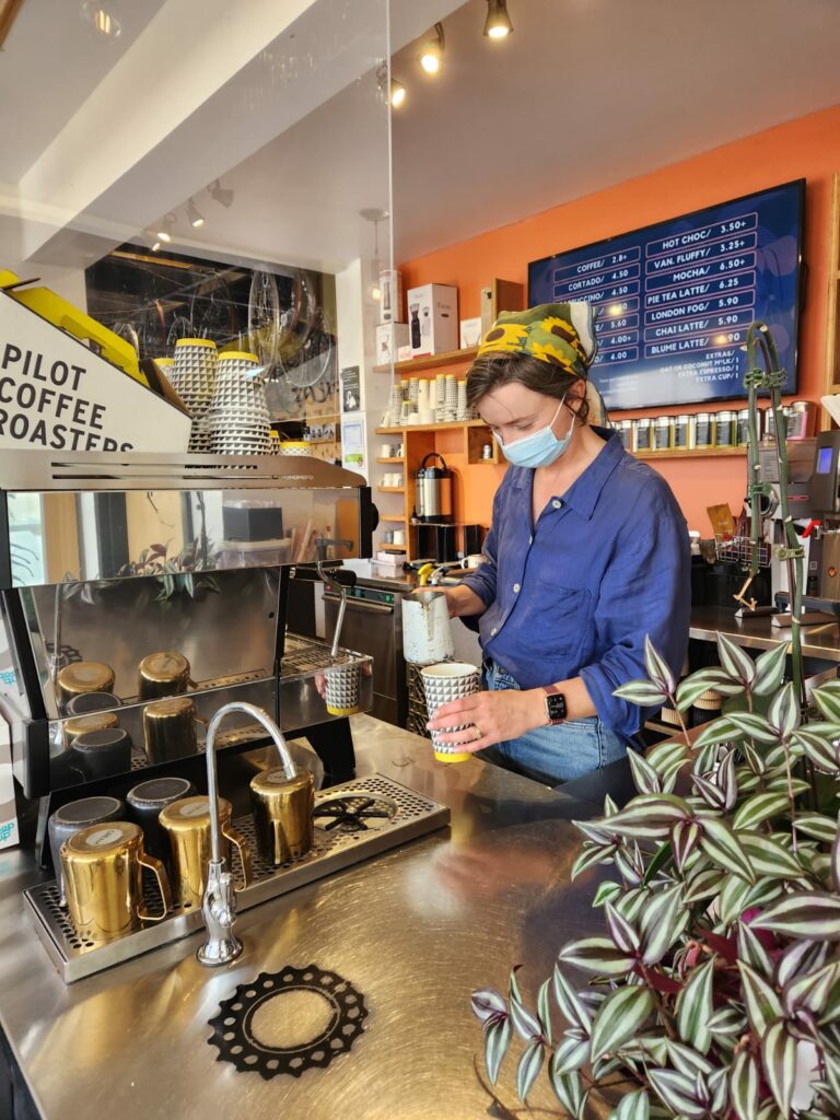 Barista pouring fresh coffee at The Brake Room Cafe in Downtown Belleville Ontario