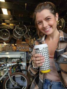 woman smiling drinking coffee