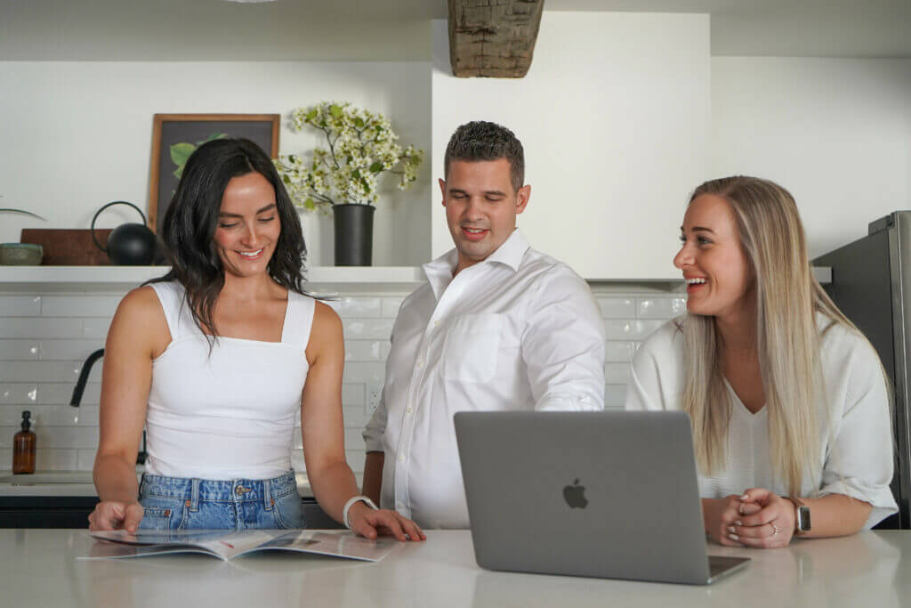 why you should use a realtor with three realtors working together