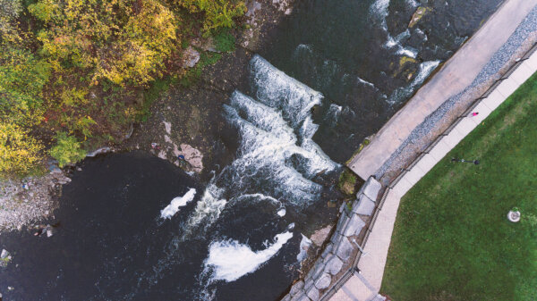 Springside Park waterfall from above in an aerial view with autumn and fall colours in the town of Greater Napanee Ontario.