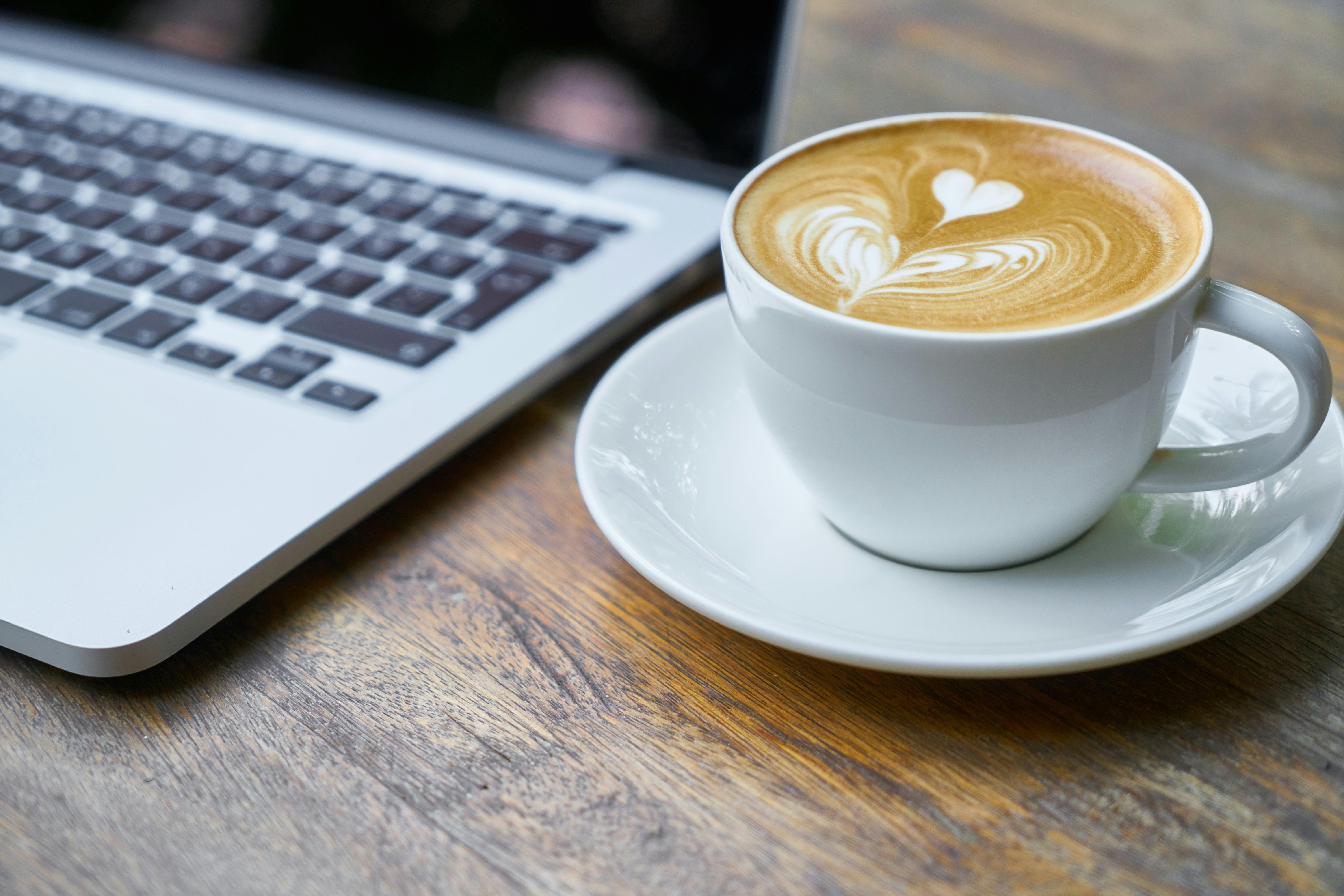 latte next to a laptop in Belleville