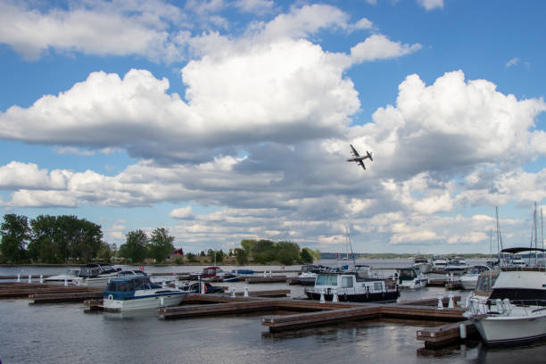 military plane flies over a marina in Trenton