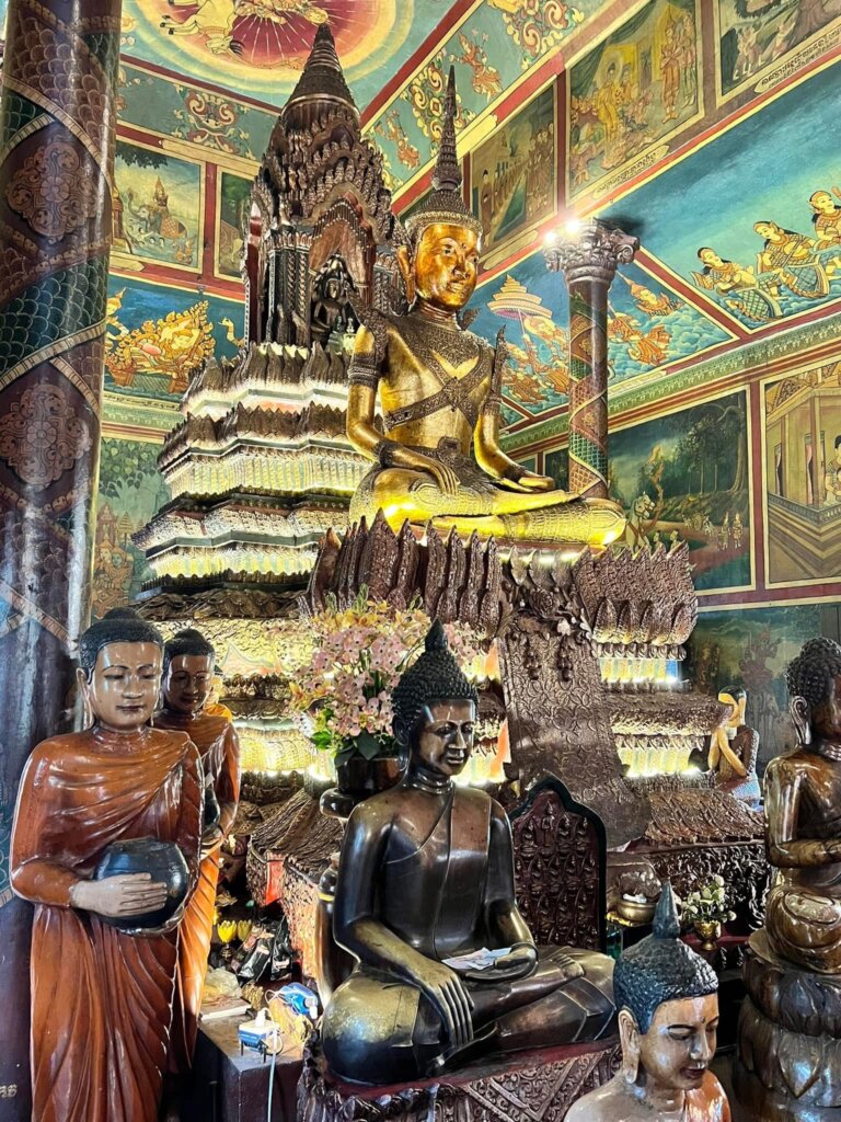 The golden interiors of the Wat Phnom Temple in Phnom Penh, Cambodia.